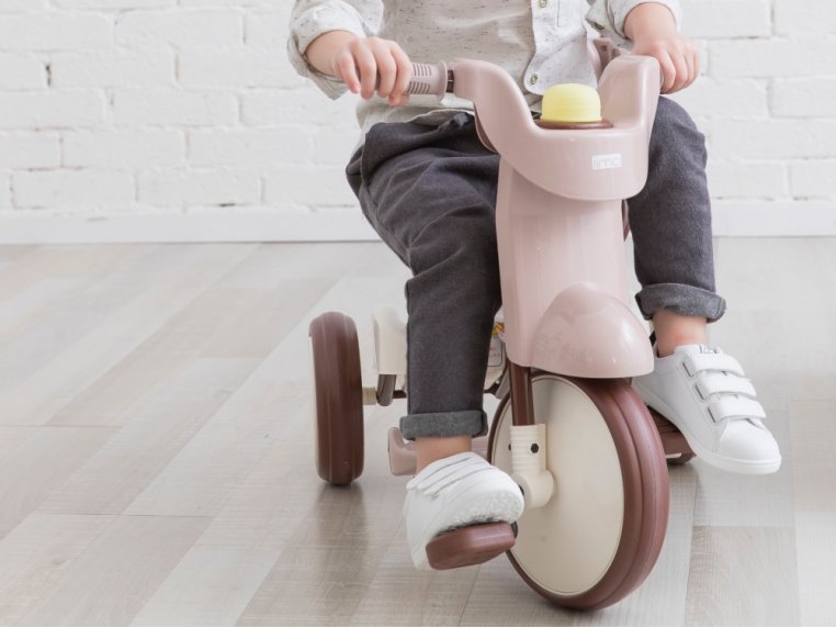 Child riding a starter bike