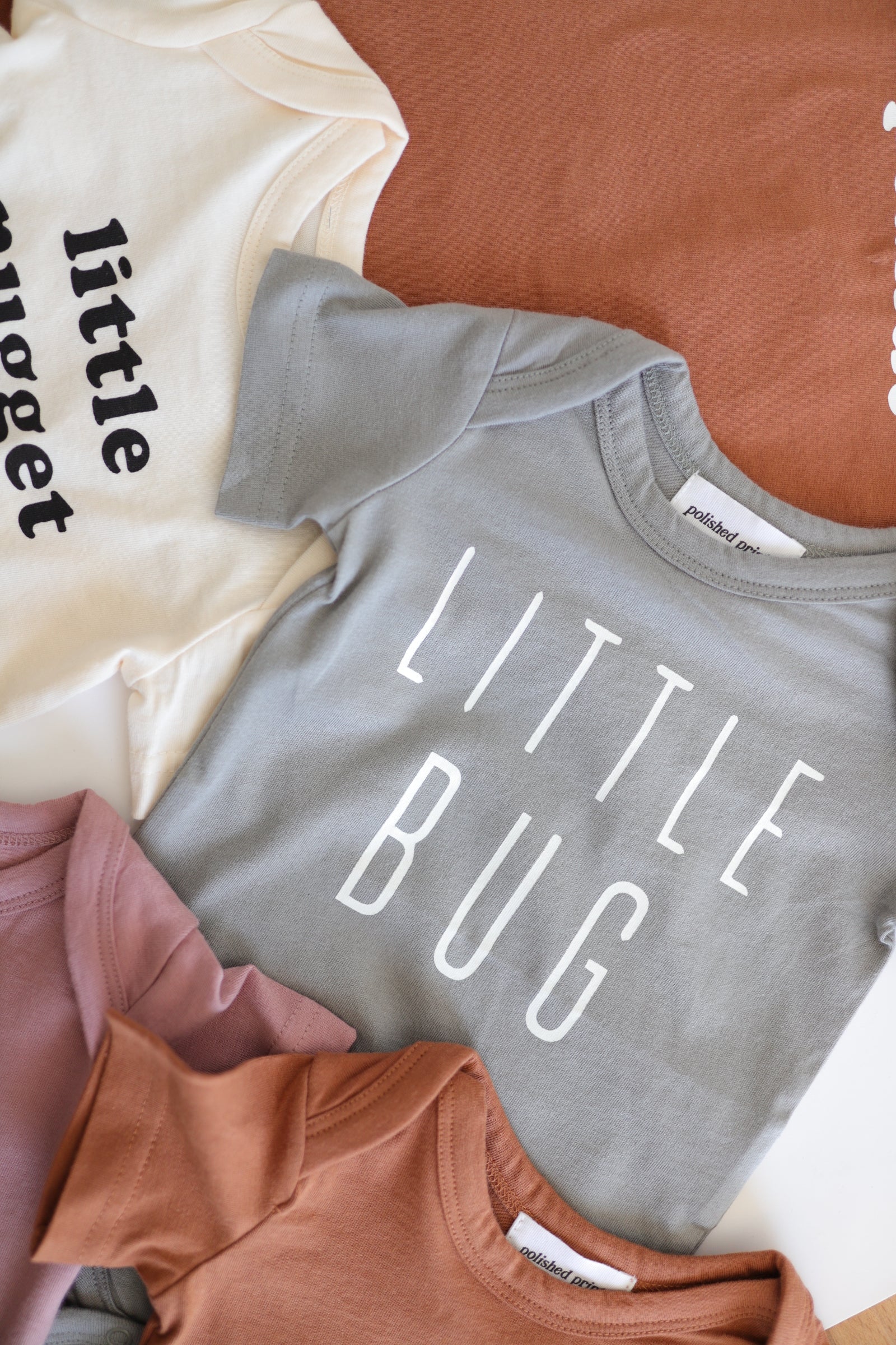 Little Bug Baby Onesie in Moon Mist Polished Prints   