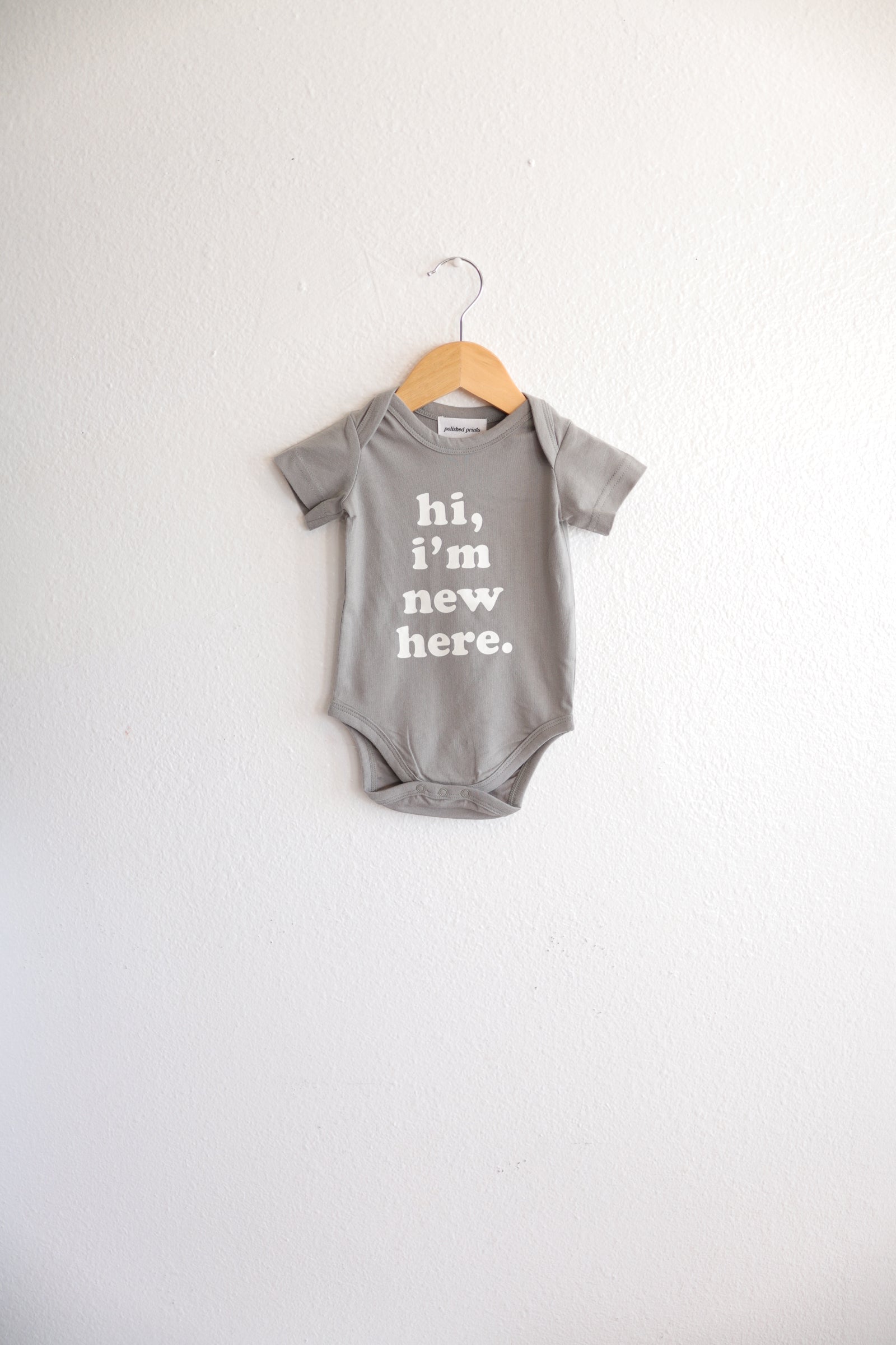 Hi, I'm New Here Baby Onesie in Moon Mist Polished Prints   