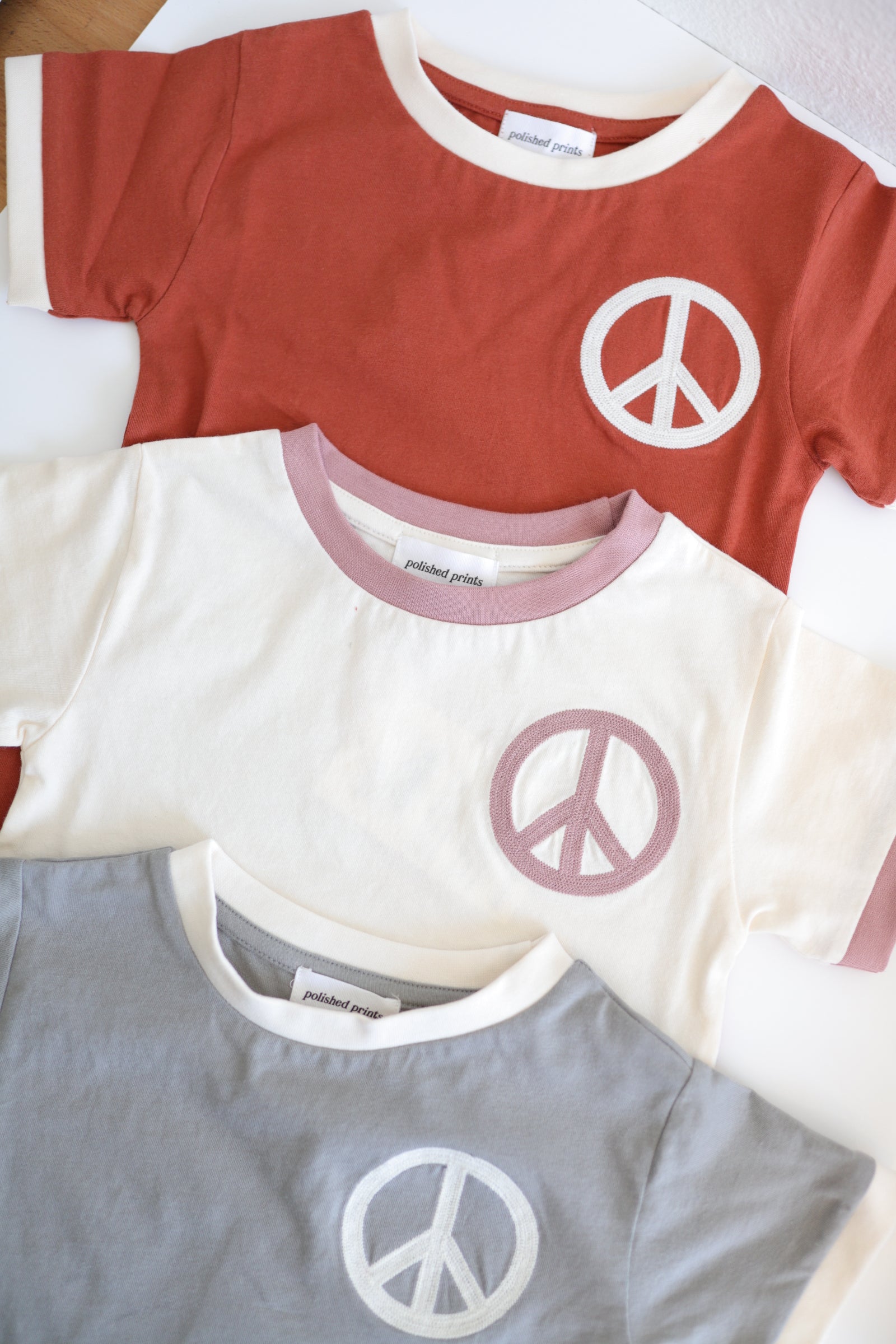 Peace Embroidered Ringer in Auburn Polished Prints   