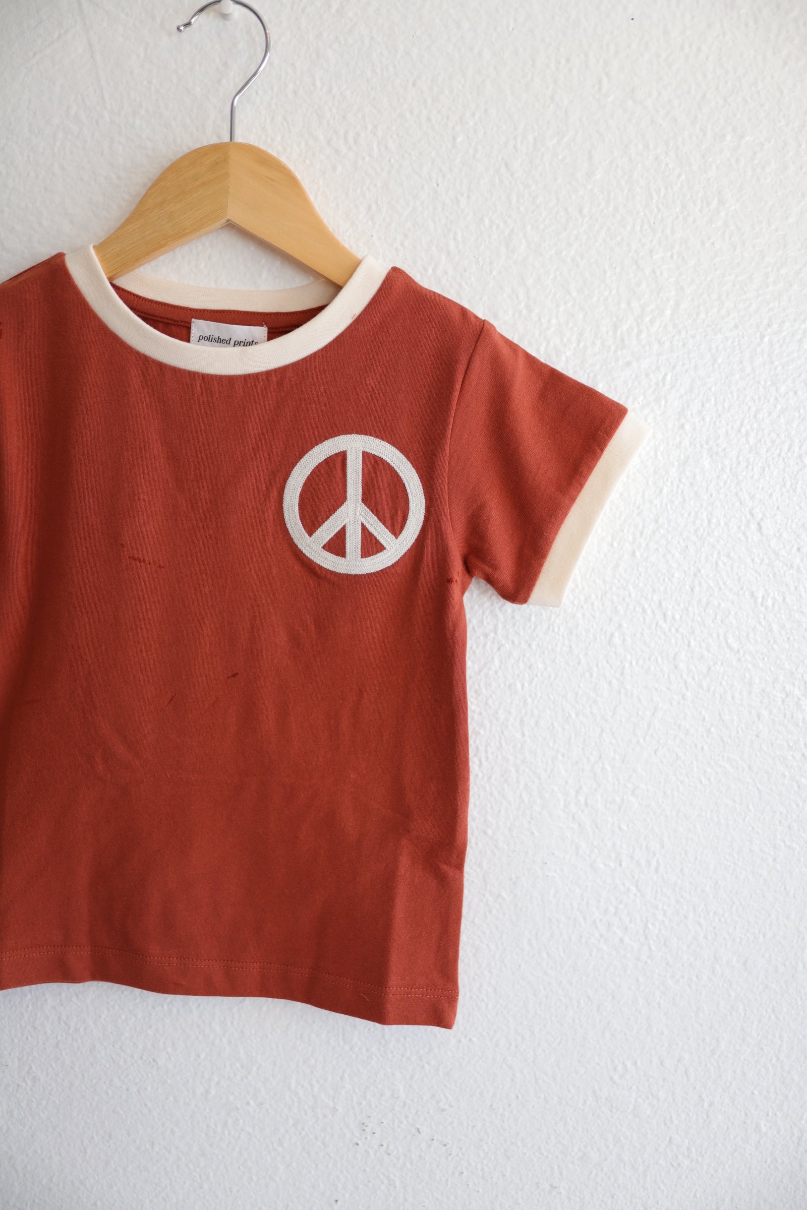 Peace Embroidered Ringer in Auburn Polished Prints   